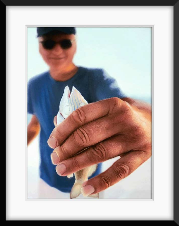 Hyper-realistic pastel drawing of man proudly holding small freshly caught fish from a fishing trip, custom portrait artwork by Kristen Ohlsson.